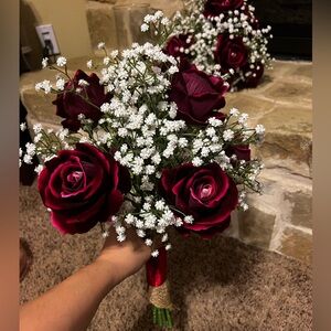 Bouquet with 6 deep red/burgundy roses and white baby’s breath. Have multiple